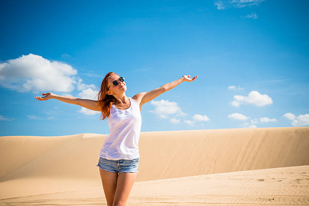 istock Beautiful woman in sand dunes 522735231