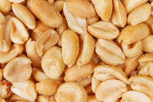 top view salted peanuts peeled full background