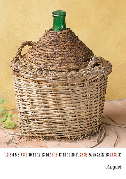 istock August calender 2015, old wine jar, demijohn. Easily customisabl 522735389
