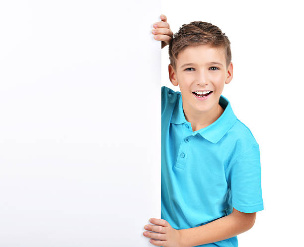 istock smiling  boy looks out from white banner 522735719