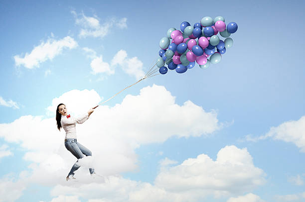 istock Woman with balloons 522735843