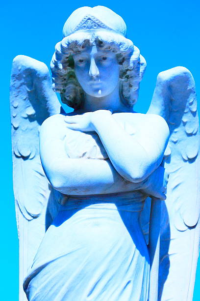 istock Blue vertical Marble Statue of angel in a cemetery grave 522735977