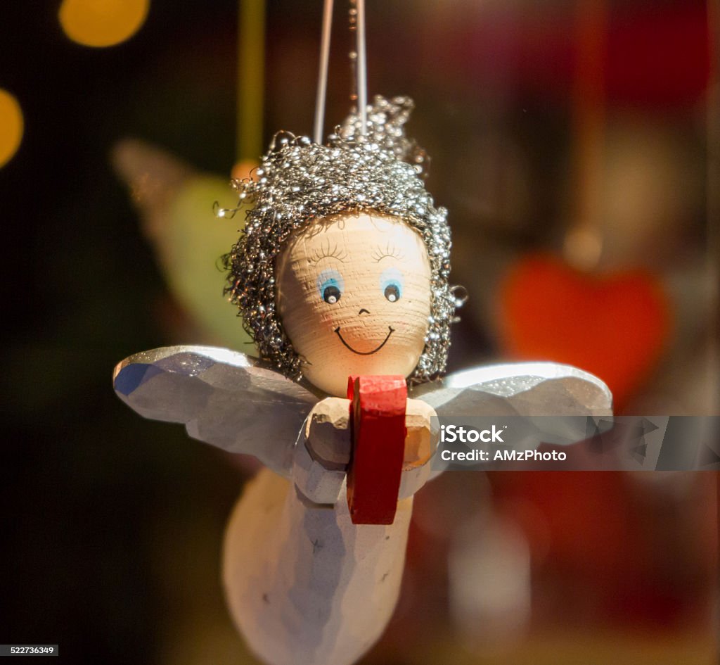 Little Angel Wooden Angel, holding a heart as a Christmas ornament Advent Stock Photo