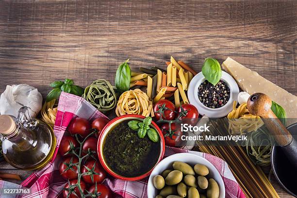 Italian And Mediterranean Food Ingredients On Old Wooden Background Stock Photo - Download Image Now