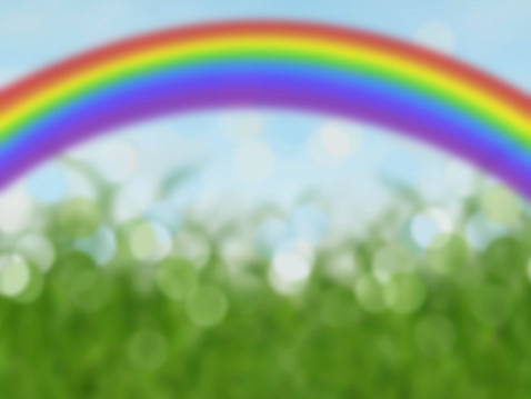 abstract colorful rainbow background with grass and blue sky