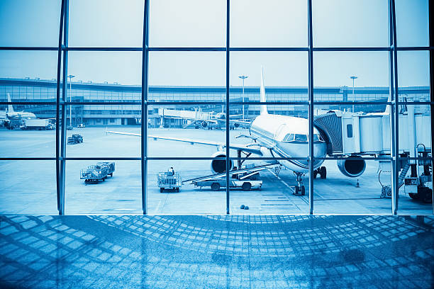 istock airplane, view from airport terminal 522737439