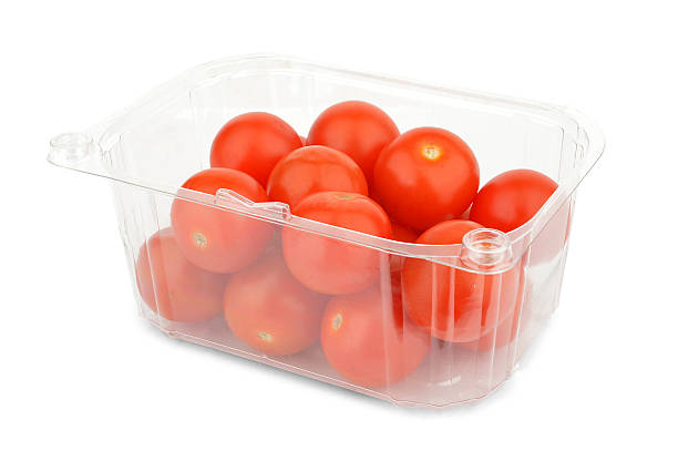 Punnet of Red cherry tomatoes - Stock Image