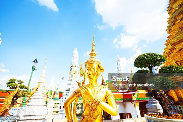 Golden Thai Statue Smelling Flower Stock Photo - Download Image Now - Architecture, Bangkok, Capital Cities