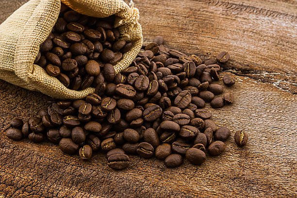 istock Brown roasted coffee beans in canvas sack. 522739377