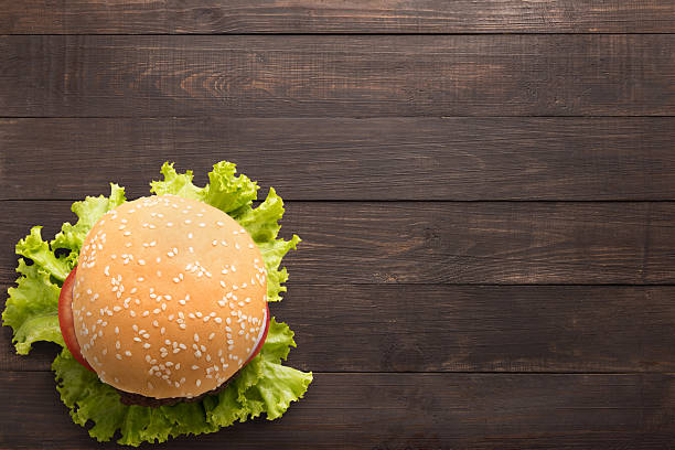 istock Top view bbq hamburger on the wooden background 522740276