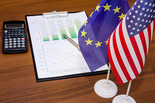 business diagram with flag of america and of europe on table