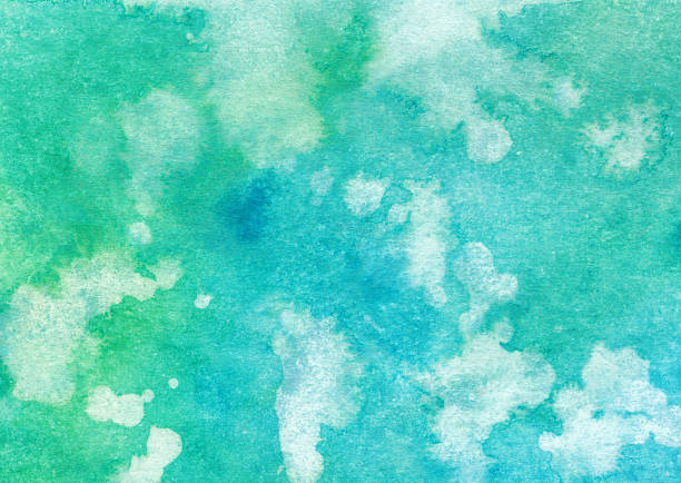 istock Bright hand painted turquoise and green background with splatters 522742536