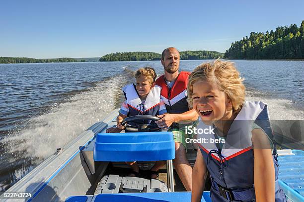 Father And Sons Boating Stock Photo - Download Image Now - Nautical Vessel, Lake, Family