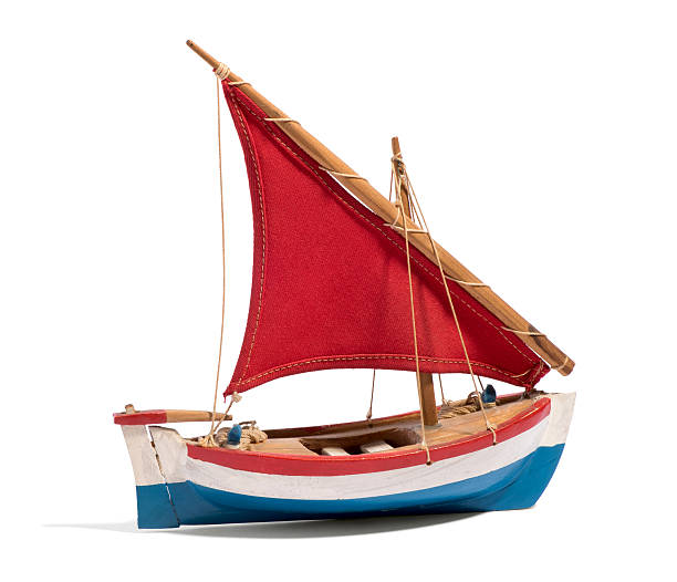 istock Wooden handmade toy boat with a red sail 522744628