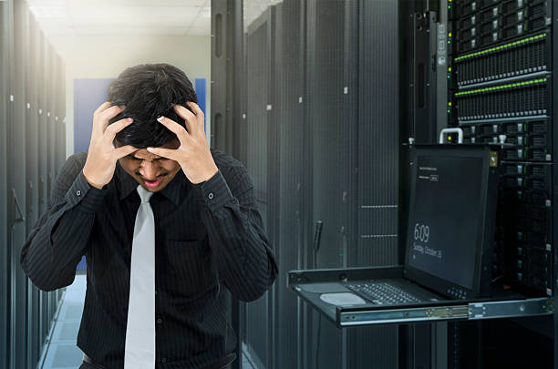 Man seroius fail in data center with trouble of server Man seroius fail in data center with trouble of server fileserver stock pictures, royalty-free photos & images