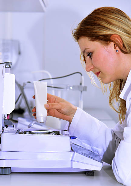 Technician Putting New Product at Laboratory Weighing Balance