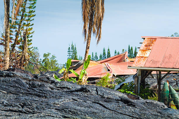 Ruined home Home ruined by advancing lava in the town of Pahoa, Big Island, Hawaii pele stock pictures, royalty-free photos & images