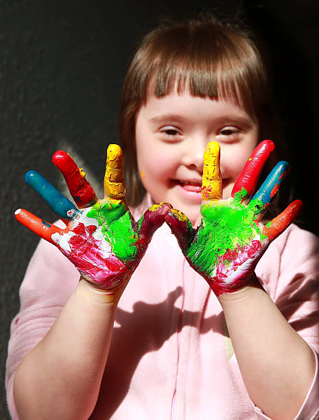 Cute little girl with painted hands
