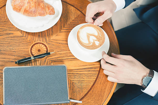 istock coffee break with a cap of coffee and croisant 522751924