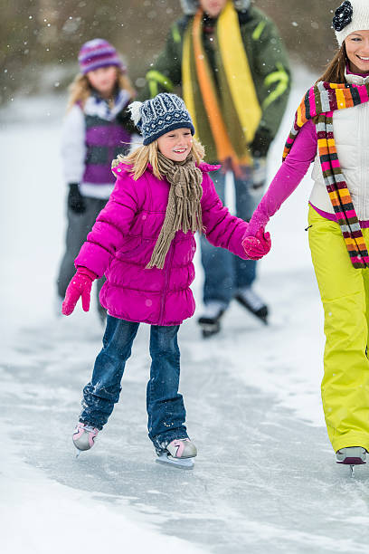 istock Family Ice-Skating on Pond 522752631