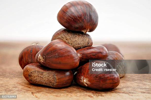 Raw Chestnuts Raw On Wooden Table Stock Photo - Download Image Now - Chestnut - Food, Chestnut Tree, Development