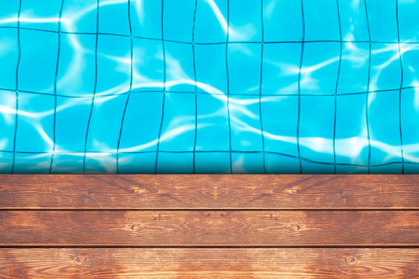 istock wooden deck on swimmung pool background 522753134