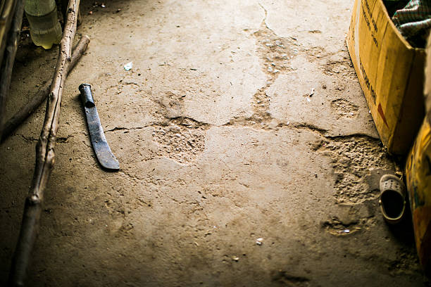 Machete lays on the floor at market in Laos A machete lays on the cement floor of a rural market, near Luang Prabang, Laos Machete stock pictures, royalty-free photos & images