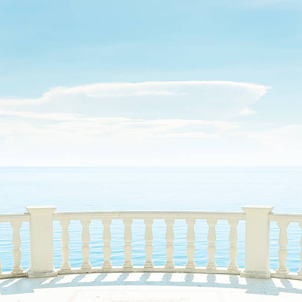 istock balcony over sea and light clouds in blue sky 522760285