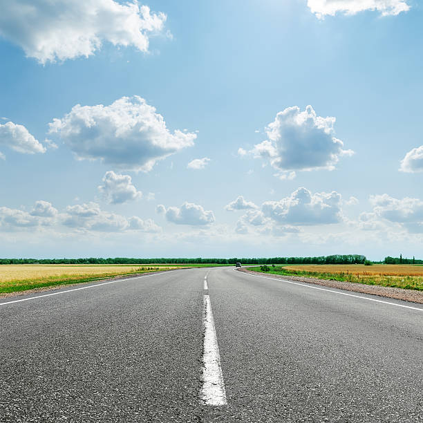 istock asphalt road with white line to cloudy horizon 522761653