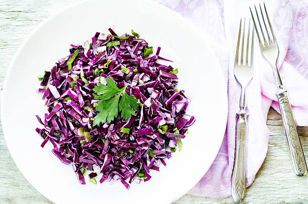 istock salad of red cabbage with onions and greens 522761891