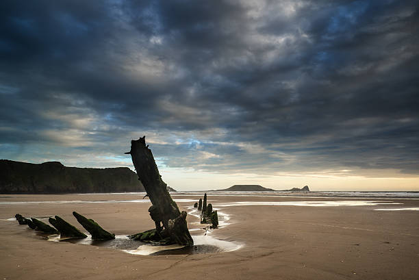 istock Landscape image of shipwreck on beach at sunset in Summer 522762133