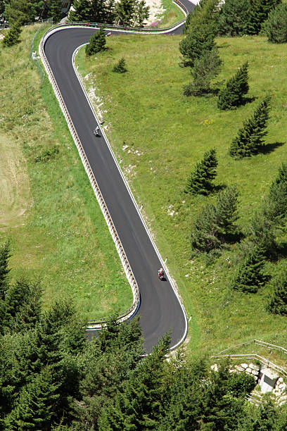 istock bikers along the way with many curves in the mountains 522762297