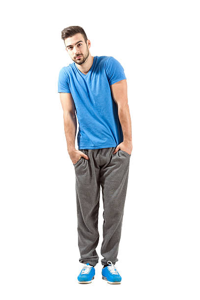 istock Sporty fit guy with hands in pocket looking at camera 522763371
