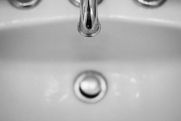 Bathroom faucet and sink stock photo