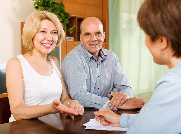istock Mature couple with insurance agent 522764895