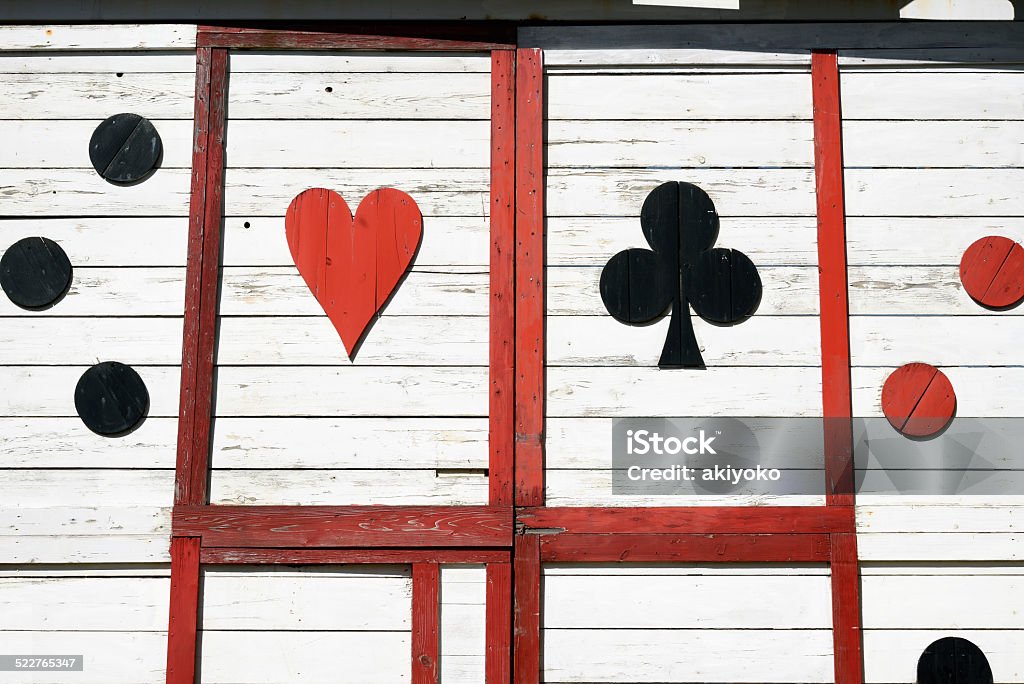 Old wooden wall Old wooden wall with playing card pattern Ace Stock Photo