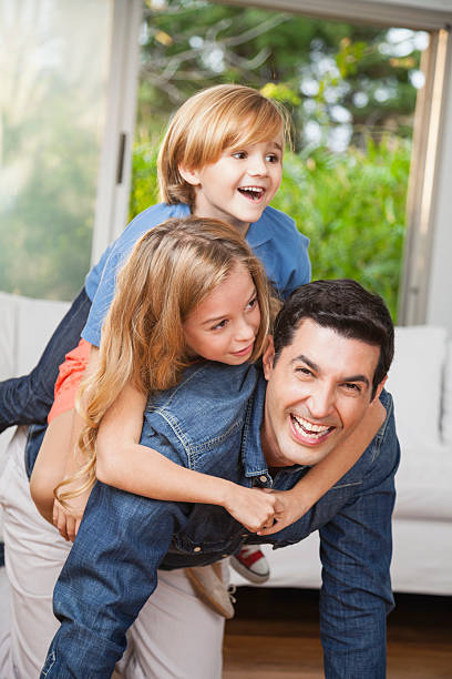 istock Father and children playing at home 522766291