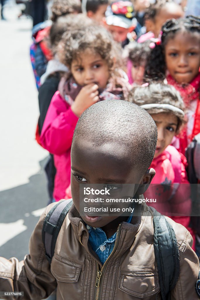 Children are Waiting Paris, France - May 22, 2014: Children are waiting in order for to enter the museum in Sacre Coure,  Paris, France. African Ethnicity Stock Photo