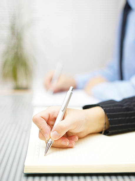 istock Business people writing notes  sitting in the office 522776591