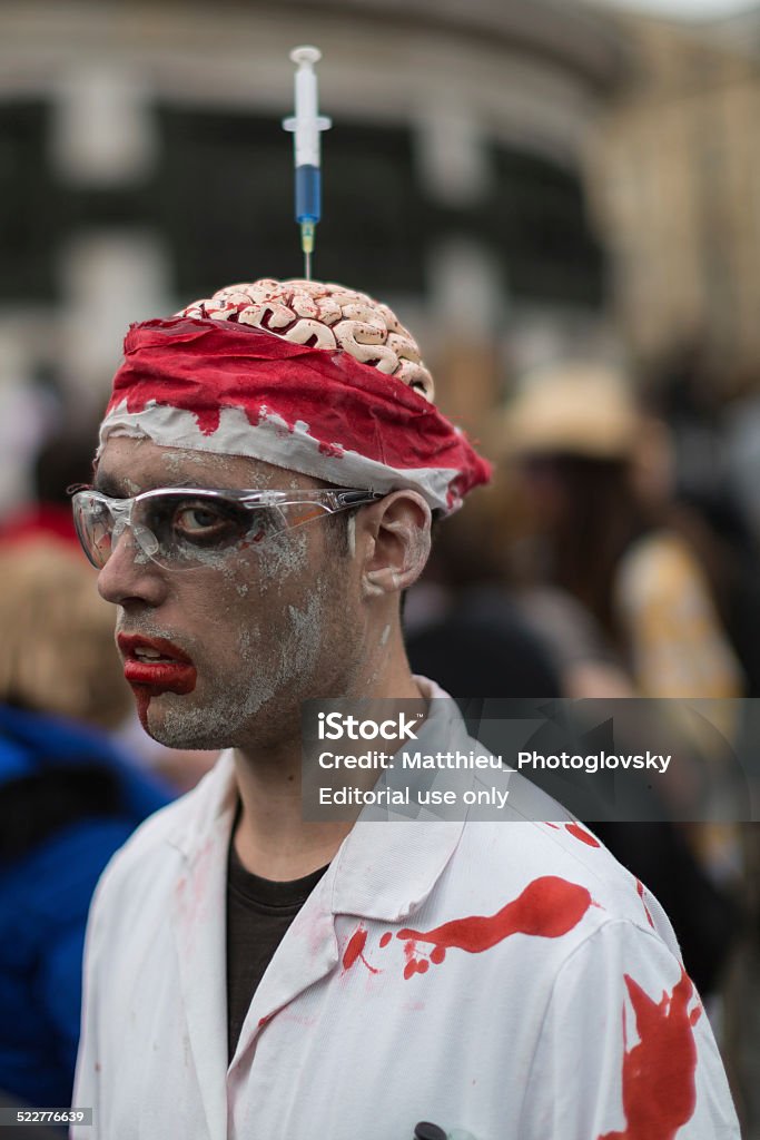 Zombie Day of walking dead Paris, France - November 8, 2014: People dressed as a zombie parades on a street during a zombie walk in Paris. Adult Stock Photo