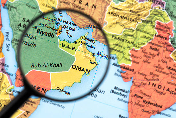 Map of Oman Map of Oman. Detail from the World Atlas. Selective Focus. qatar map stock pictures, royalty-free photos & images