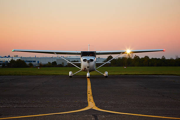 Private airplane Young pilot is preparing for take off with private plane taxiway stock pictures, royalty-free photos & images
