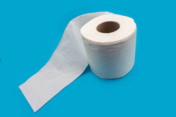 istock High angle view of single toilet paper over blue background 522779978