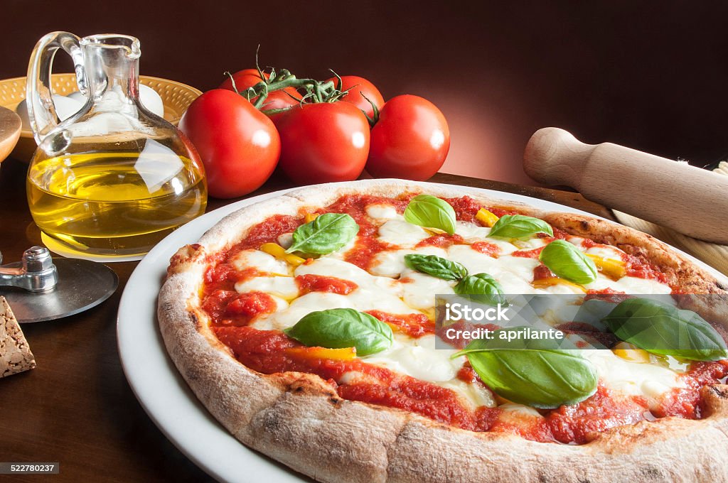 Pizza on the table pizza on the wooden table with ingredients Baked Pastry Item Stock Photo