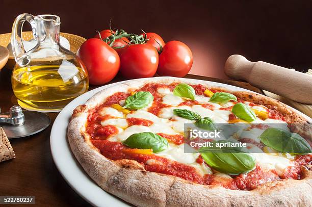 Pizza On The Table Stock Photo - Download Image Now - Baked Pastry Item, Bakery, Cooking