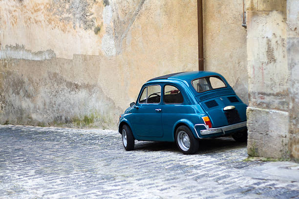istock Cute Blue Vintage Car Against Old Textured Wall, Sicily 522780679
