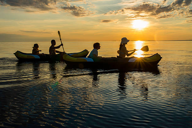 istock Having Fun Sea Kayaking At Sunset 522781193