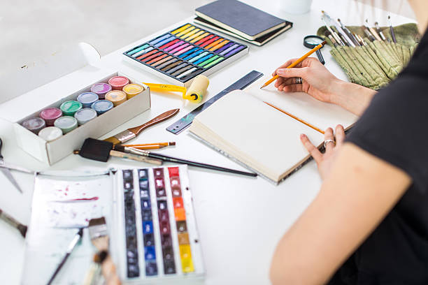 istock Back angle view of an artist creating new picture using 522781484
