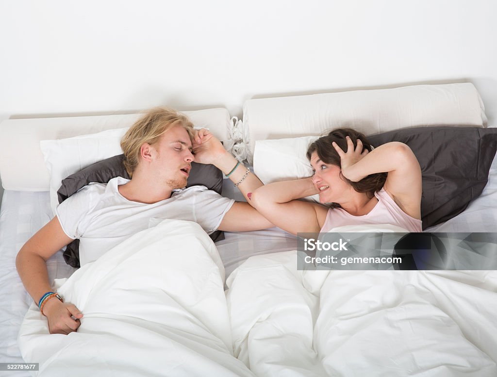 Frustrated wife Frustrated wife when husband snoring 20-29 Years Stock Photo