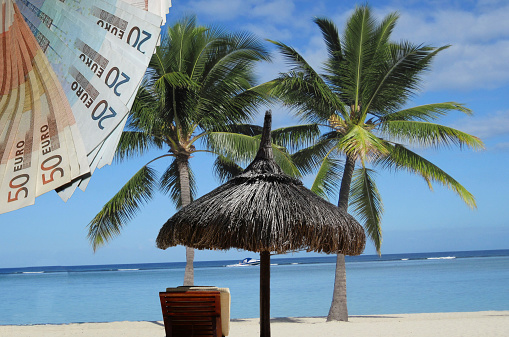 Stand, sun, sea, palm beach chair. So one imagines a tax haven.